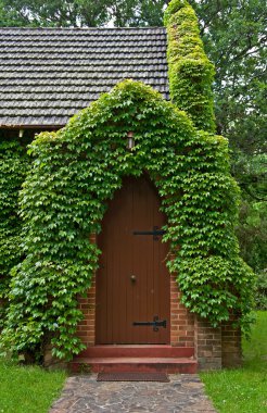 Vine covered church building clipart