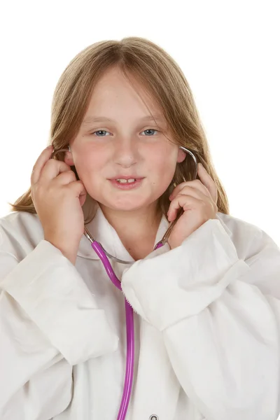 Young girl pretending to be a doctor Stock Image