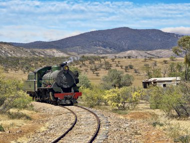 Steam train coming around the corner clipart