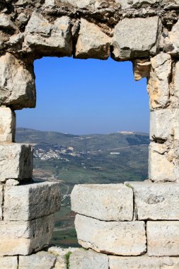 Hole in the castle wall, Syria clipart