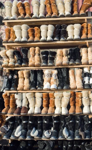 Showcase with warm winter boots — Stock Photo, Image