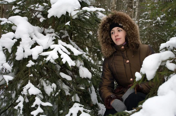 stock image A girl in winter forest