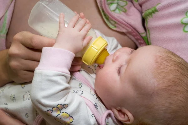 Feeding baby bottle Stock Image