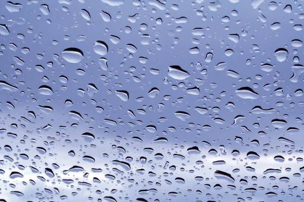 Blauwe regen druppels — Stockfoto