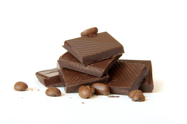 Högen av choklad och kaffe bönor — Stockfoto