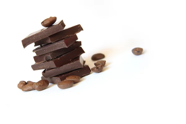 Heap of chocolate and coffee beans — Stock Photo, Image