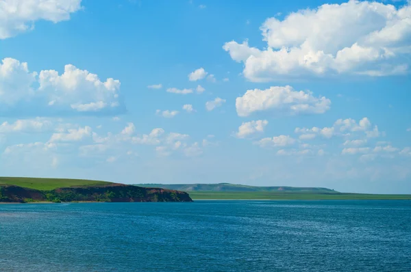 stock image Quiet water of lake and cloudy sky