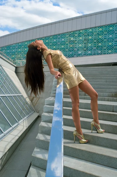 stock image Girl in a golden dress