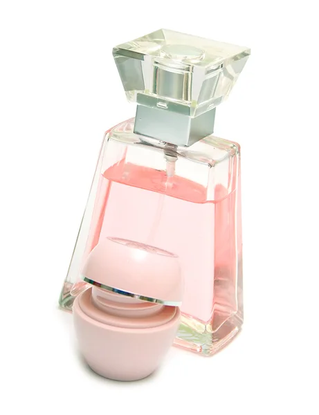 Perfume e creme de cor rosa — Fotografia de Stock