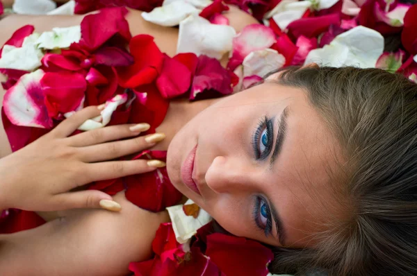 Girl in rose petal Royalty Free Stock Images