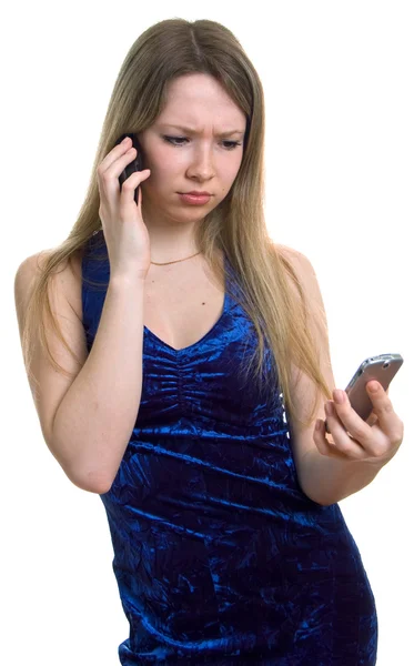 Triest meisje in blauwe jurk met twee cellular — Stockfoto