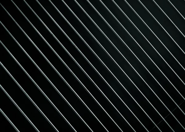 Treillis métallique sur un noir — Photo
