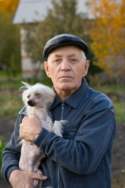 Elderly man with a dog — Stock Photo, Image