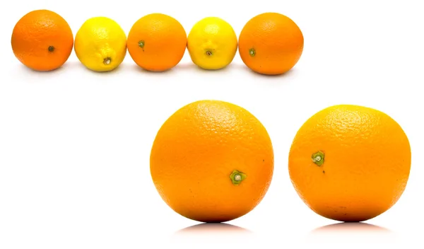 Апельсины и желтые лимоны — стоковое фото