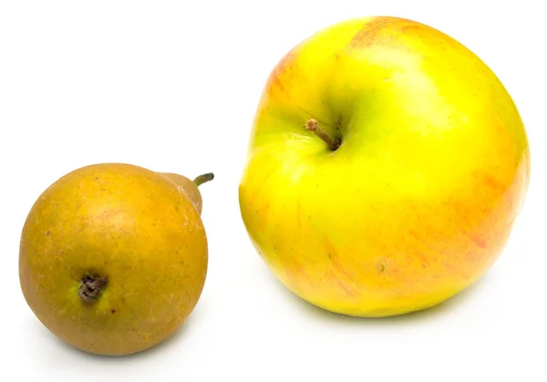 Зелена груша і жовте яблуко — стокове фото