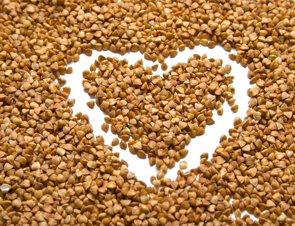 Heart on buckwheat — Stock Photo, Image