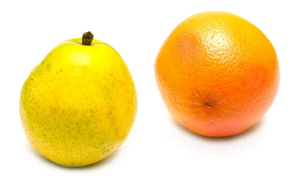 Grapefruit and yellow pear — Stock Photo, Image