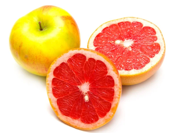 Röd grapefrukt och gula äpple — Stockfoto