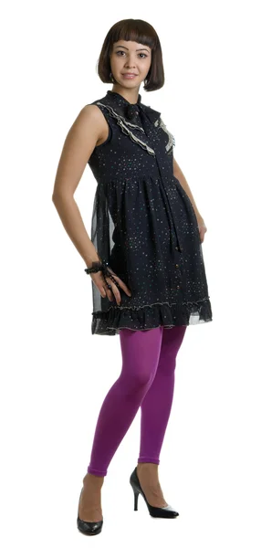 Chica en un vestido oscuro y calcetín lila — Foto de Stock