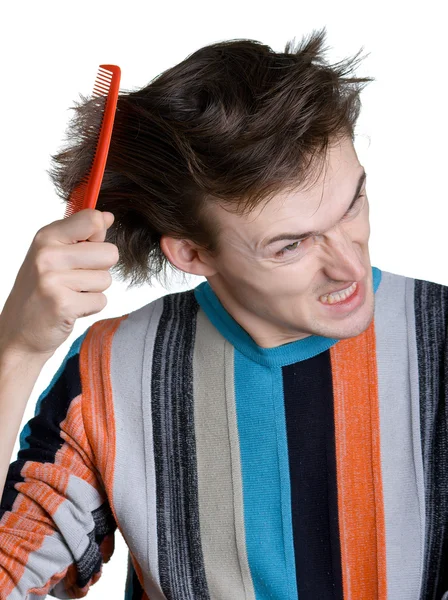 Jeune homme avec la brosse à cheveux — Photo