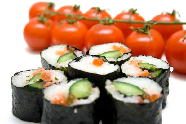 Japanese sushi and ripe red tomatoes — Stock Photo, Image