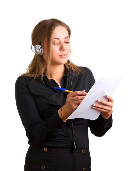 Women in headphones with pen and paper — Stock Photo, Image