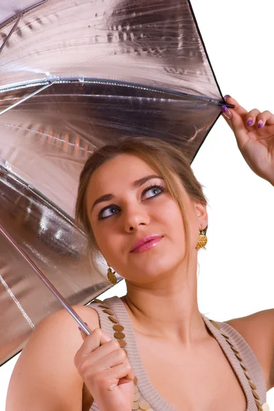 Women in golden dress with umbrella — Stock Photo, Image