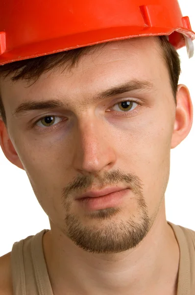 Mladý dělník v červené budově helma — Stock fotografie