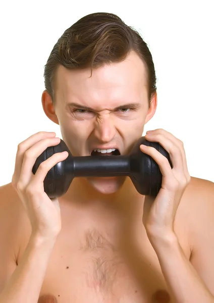 Man tries to eat a dumbbells — Stock Photo, Image