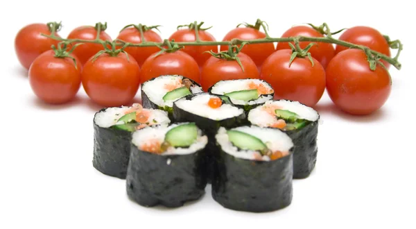Japanese sushi and ripe red tomatoes — Stock Photo, Image