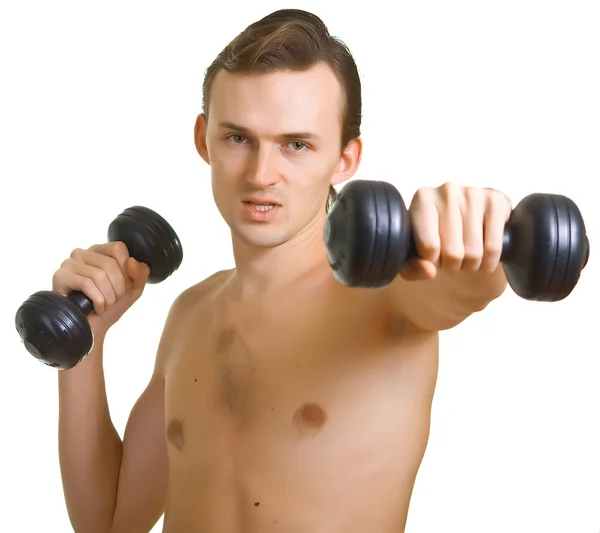 Молодий голий чоловік з гантелями — стокове фото