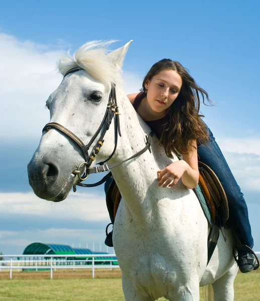 Serenity young girl astride a horse — Stock Photo, Image