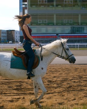 Girl astride a horse clipart