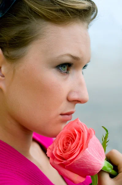 Girl with pink rose — Stock Photo, Image