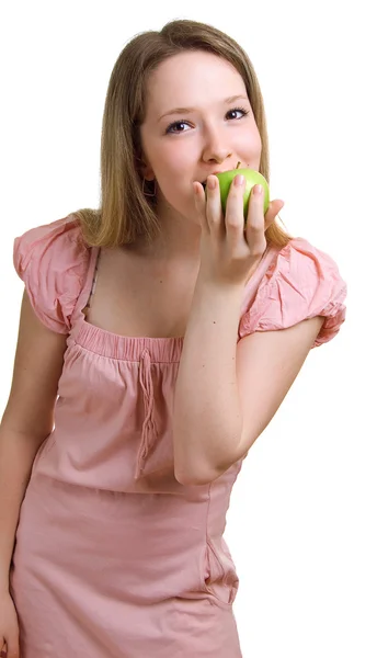 Beautiful girl eats a green apple — Stock Photo, Image