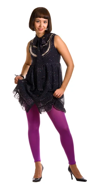 Flicka i en mörk klänning och lila stockin — Stockfoto