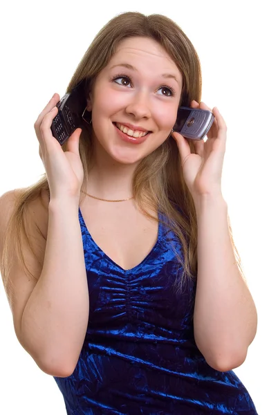Menina sorridente com dois celulares — Fotografia de Stock