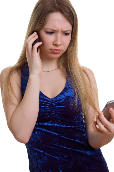 Menina triste com dois celulares — Fotografia de Stock