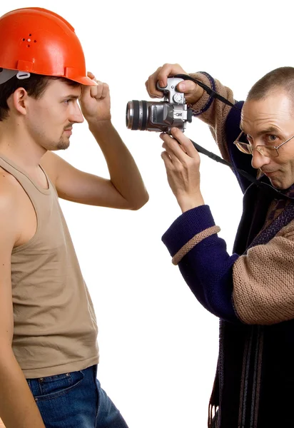 Elderly photographer and young builder — Stock Photo, Image