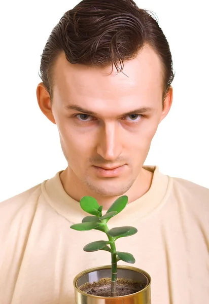 男子与年轻的植物 — 图库照片