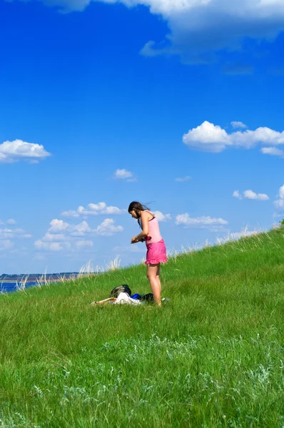Girl against summer landscape — Stock Photo, Image