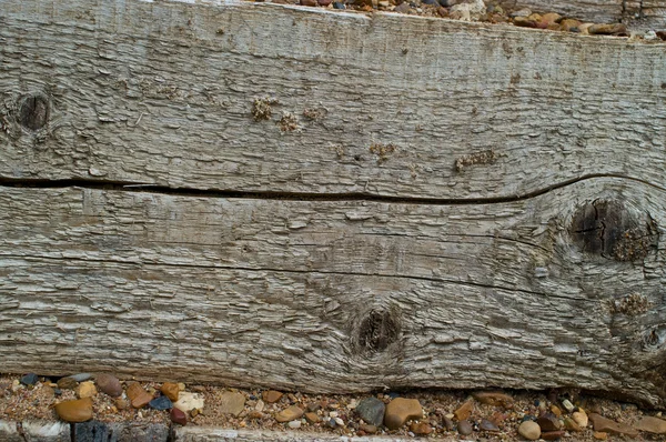 Superfície de madeira com pedras — Fotografia de Stock