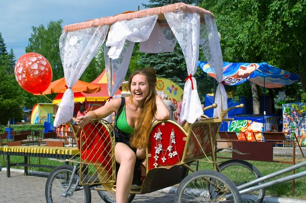 Girl in the carriage — Stock Photo, Image