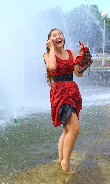 Stock image Laughing girl in wet clothes