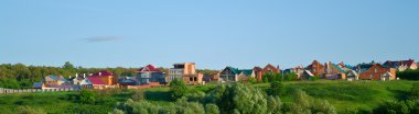 Some cottages on a hill clipart