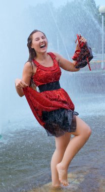 Laughing girl in wet clothes clipart