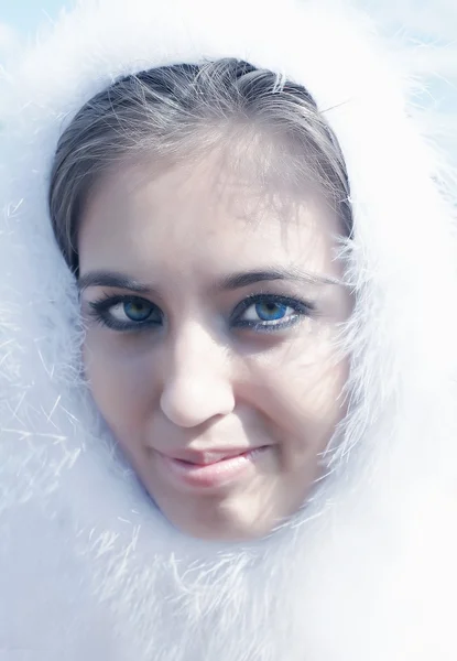 Beautiful girl in a white boa — Stock Photo, Image