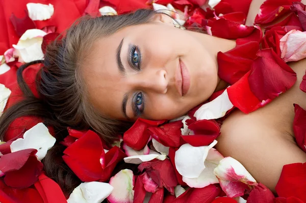 Young girl in rose peta — Stock Photo, Image