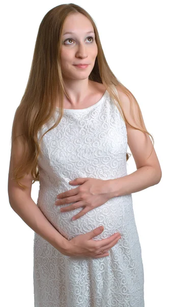Беременные женщины в белом платье — стоковое фото