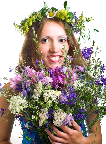 Smiling young women with flowers — Stock Photo, Image